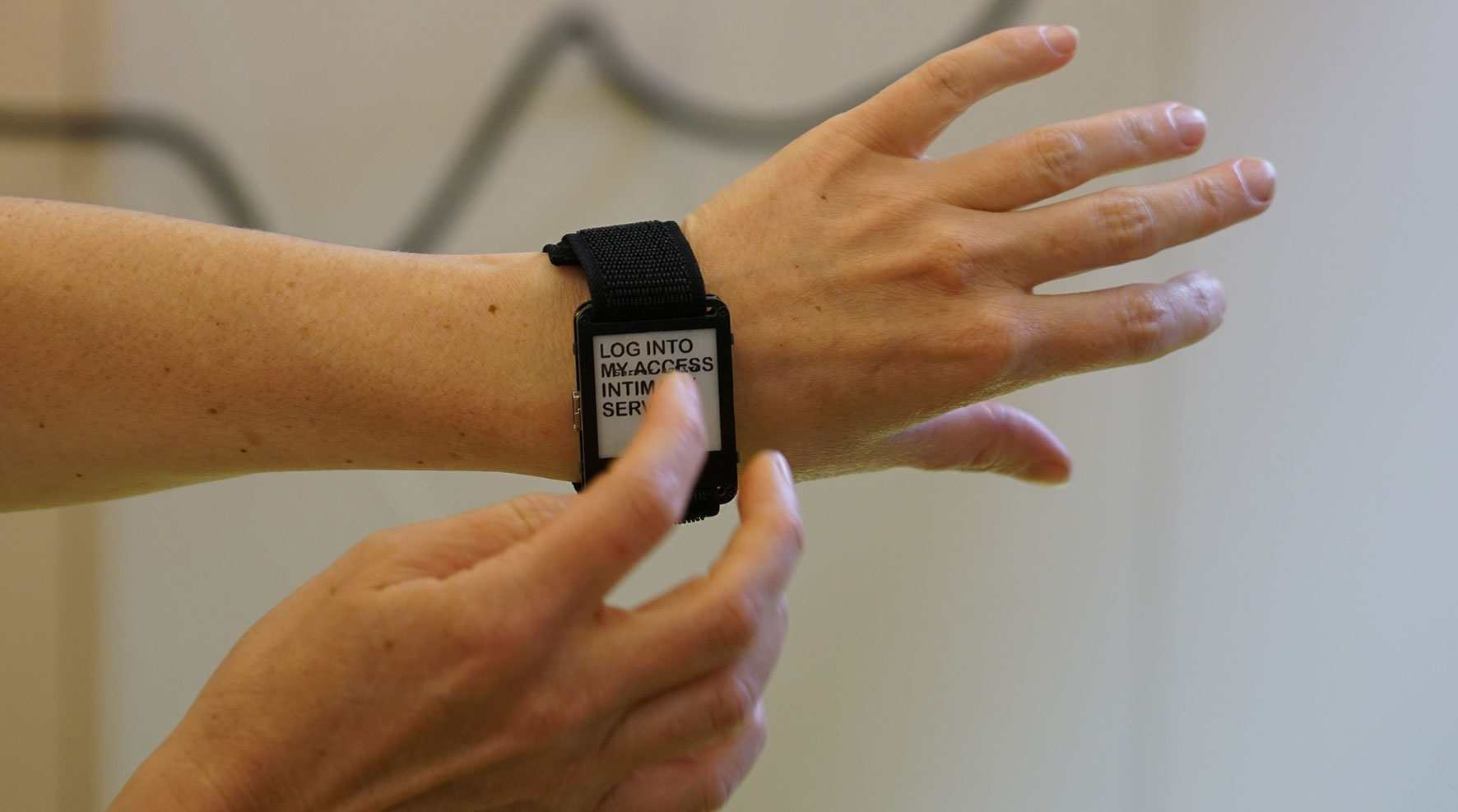 E-ink wrist band and wifi module showing an access rider